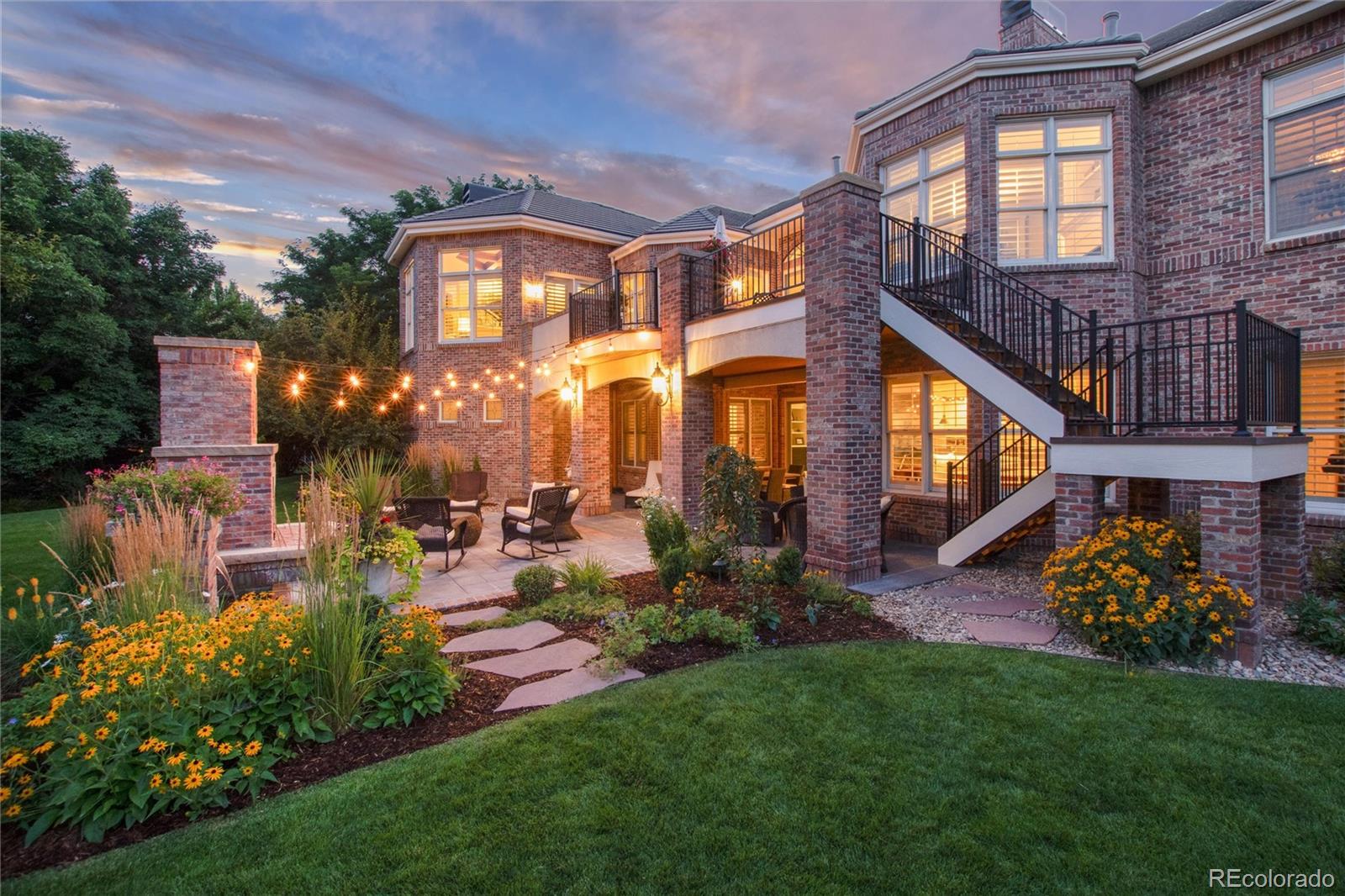 7175 Polo Ridge Drive Littleton, CO 80128 - Photo 42 of 50 a view of a building with a garden