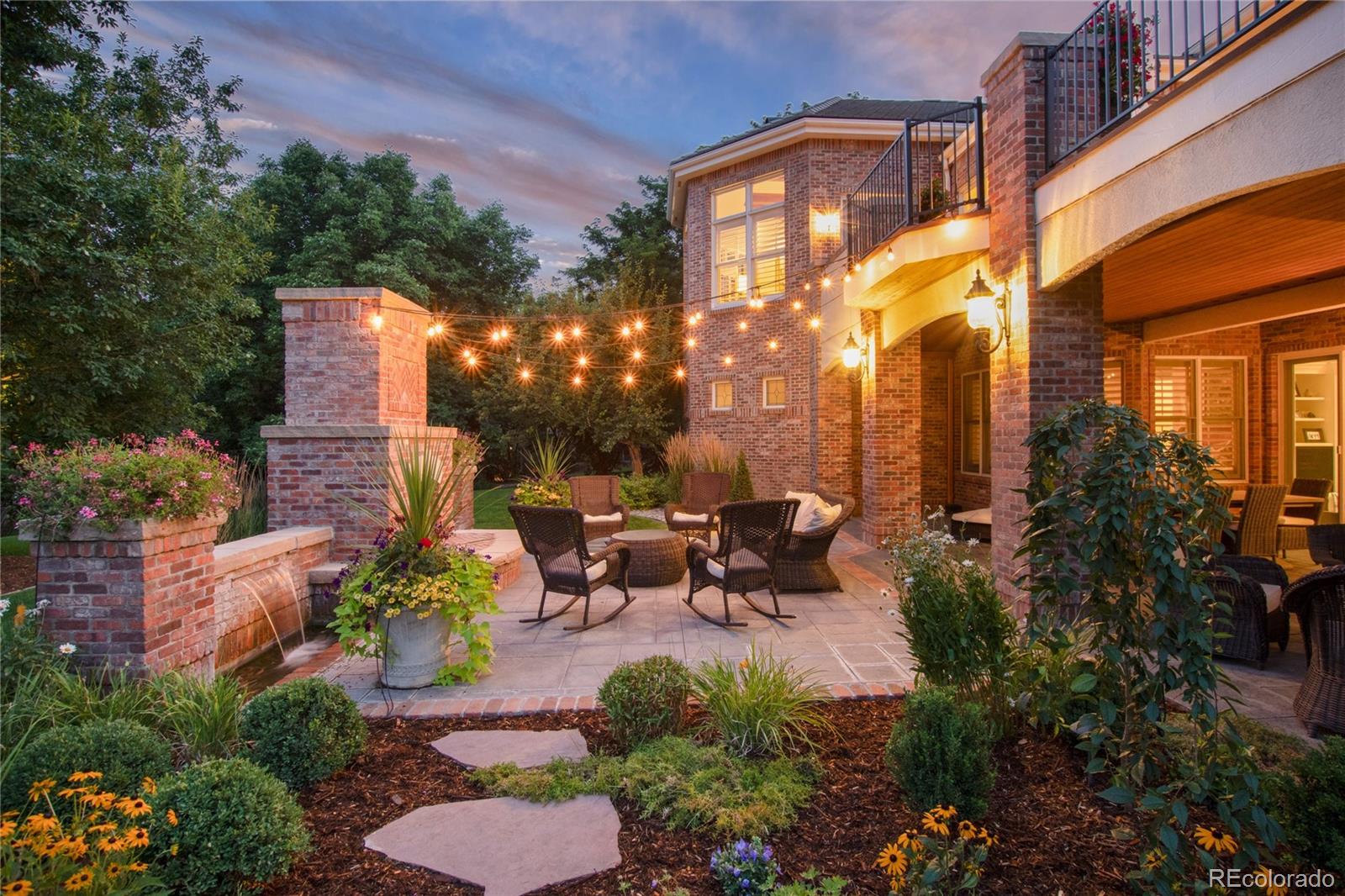 7175 Polo Ridge Drive Littleton, CO 80128 - Photo 43 of 50 a view of a patio with couches table and chairs and potted plants