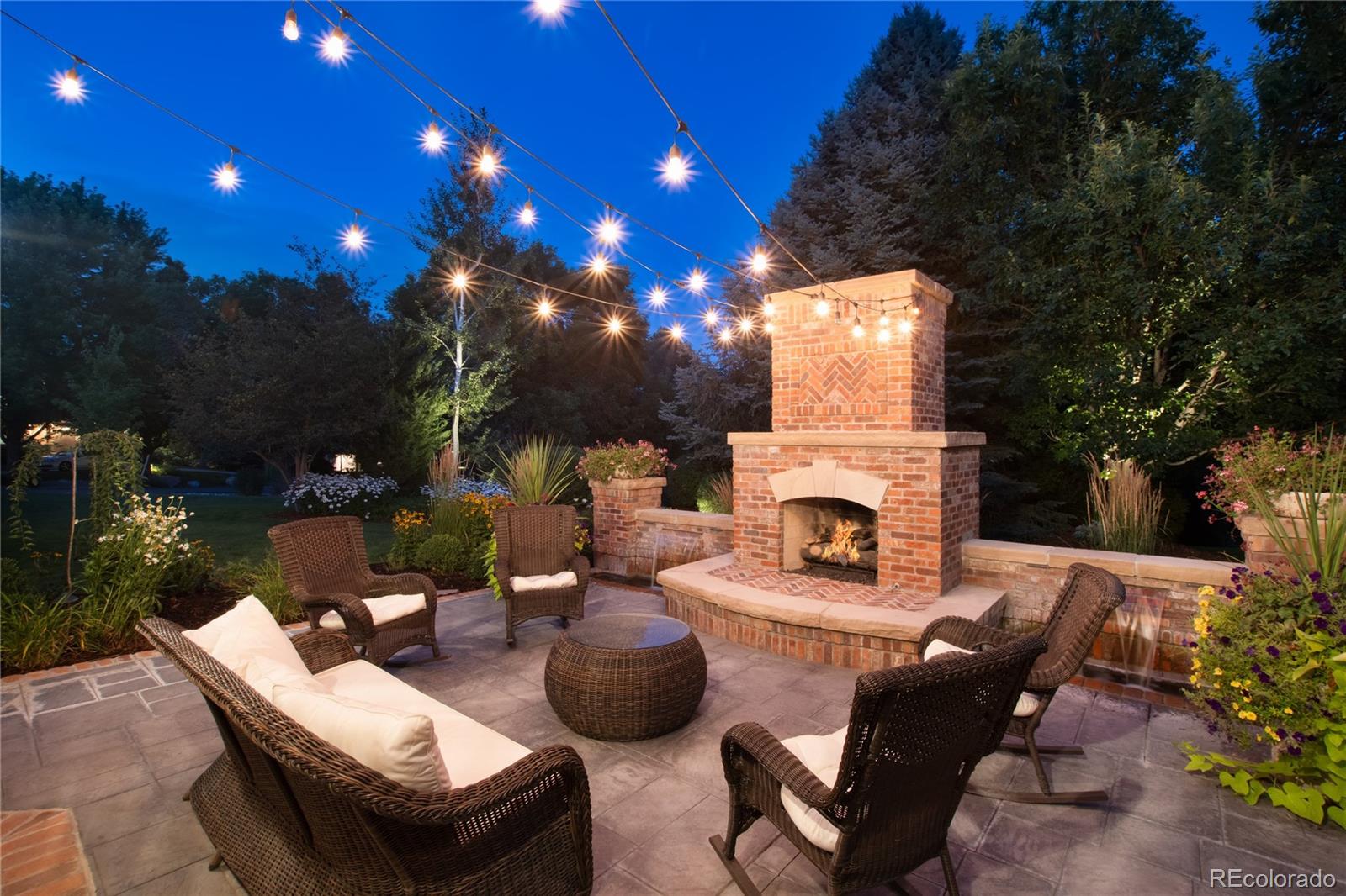 7175 Polo Ridge Drive Littleton, CO 80128 - Photo 44 of 50 a outdoor space with patio furniture and a fireplace