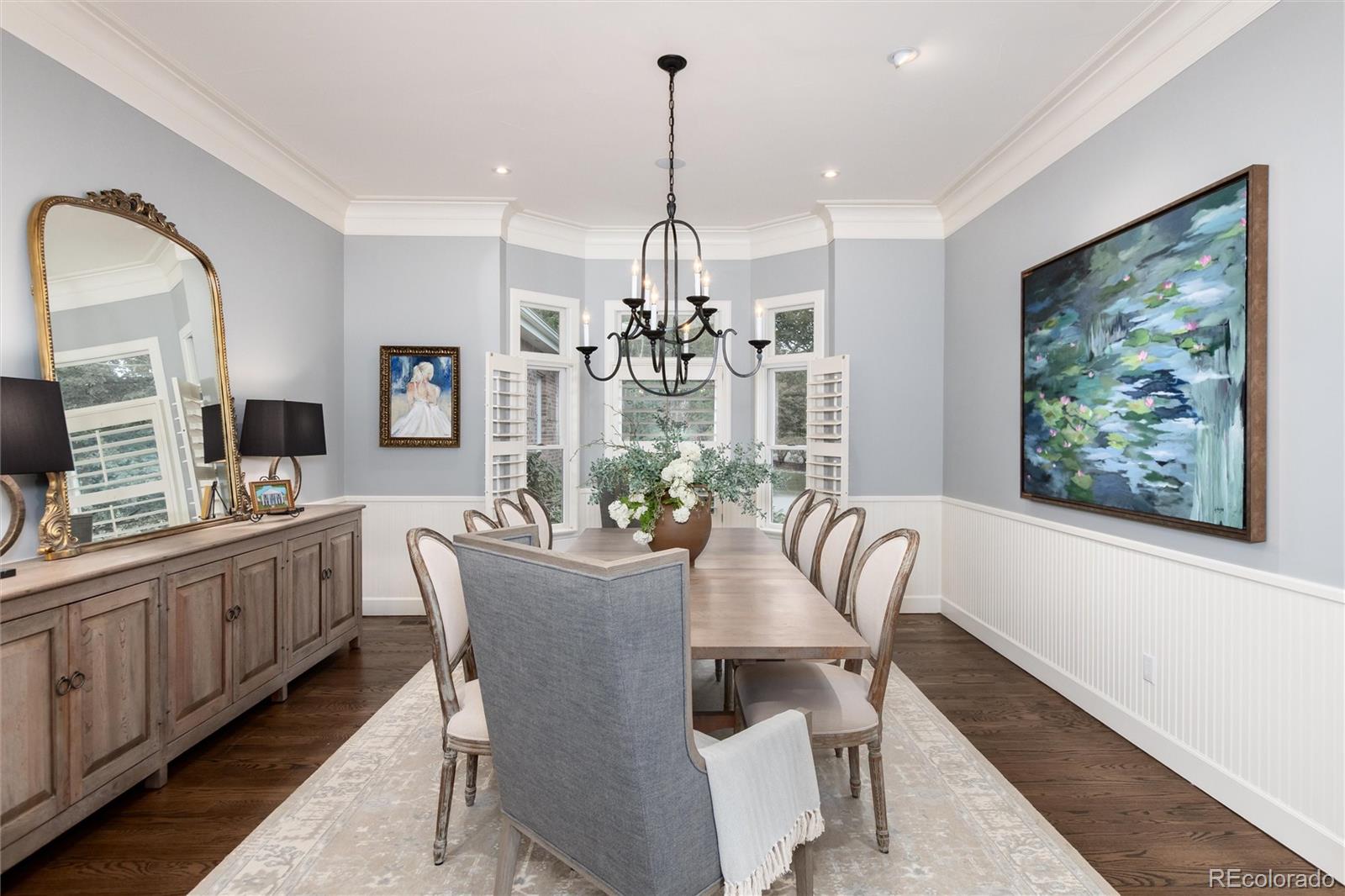 7175 Polo Ridge Drive Littleton, CO 80128 - Photo 6 of 50 a dining room with furniture a chandelier and window