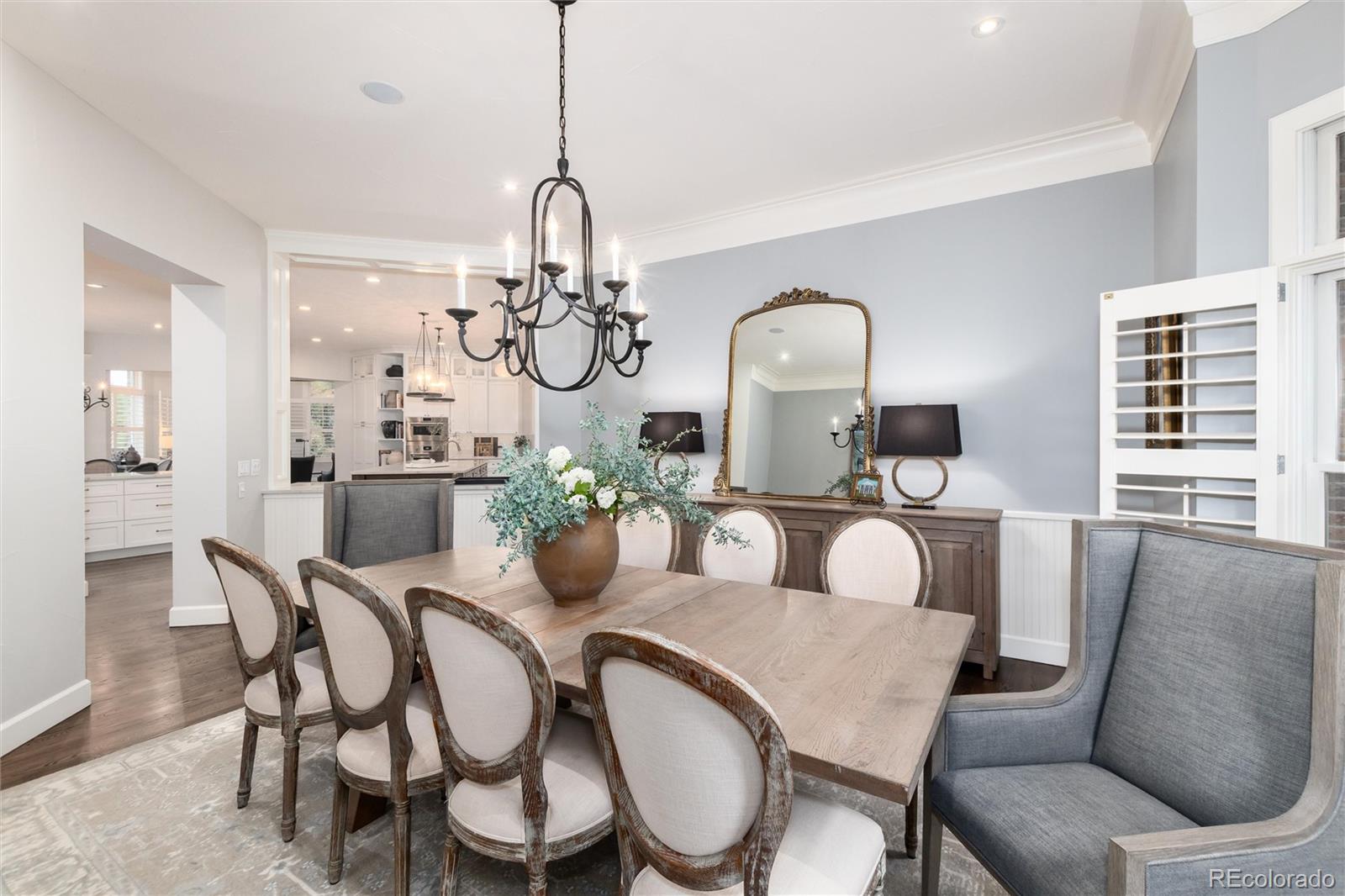 7175 Polo Ridge Drive Littleton, CO 80128 - Photo 7 of 50 a dining room with furniture a chandelier and window