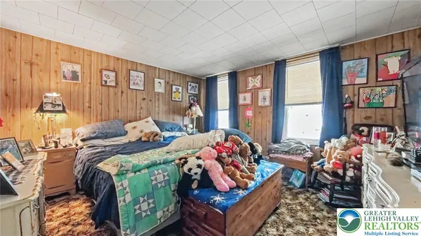 a bed room with a bed and a window
