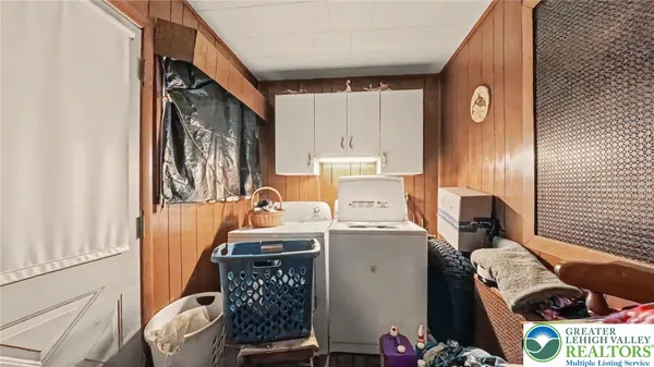 a view of storage and utility room with a sink
