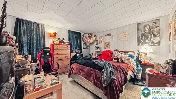 a bedroom with bed and a closet