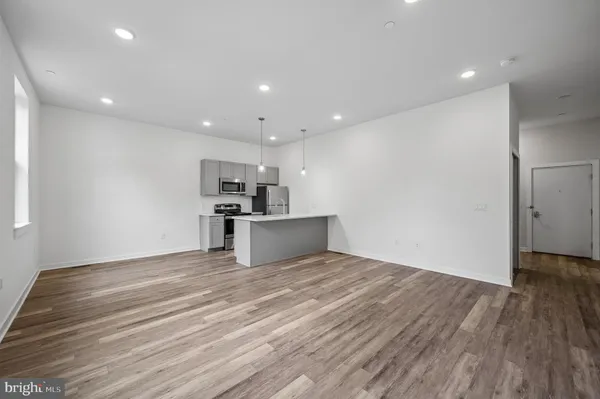 a view of kitchen with wooden floor
