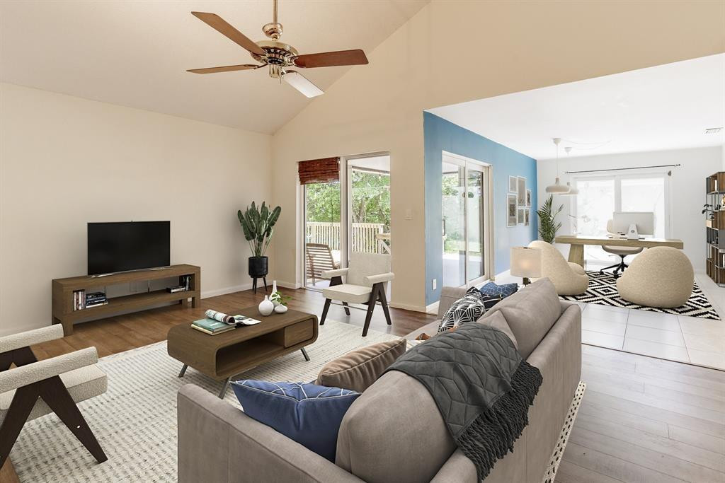 a living room with furniture and a flat screen tv