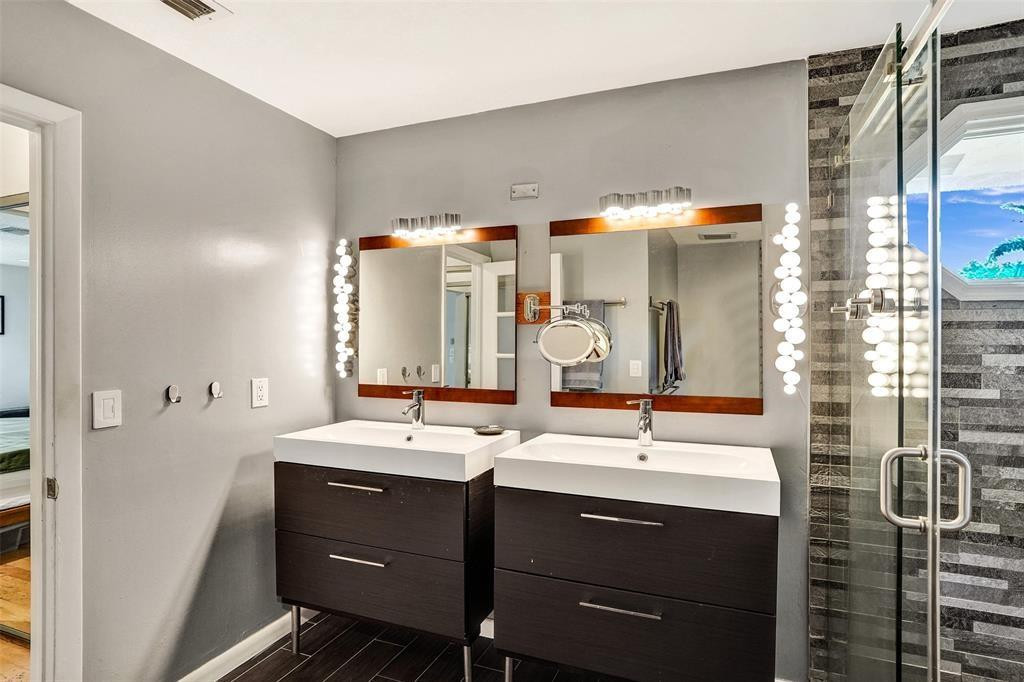 2945 Begonia Way Cooper City, FL 33026 - Photo 13 of 26 a bathroom with a sink and a mirror