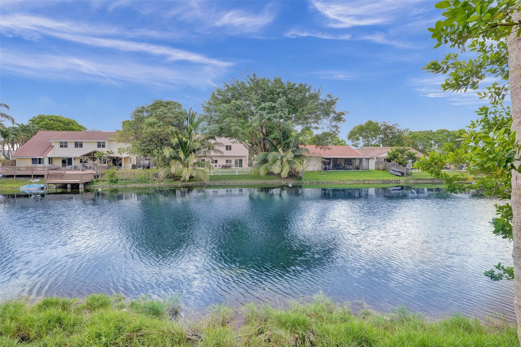 2945 Begonia Way Cooper City, FL 33026 - Photo 18 of 26 a view of a lake with houses