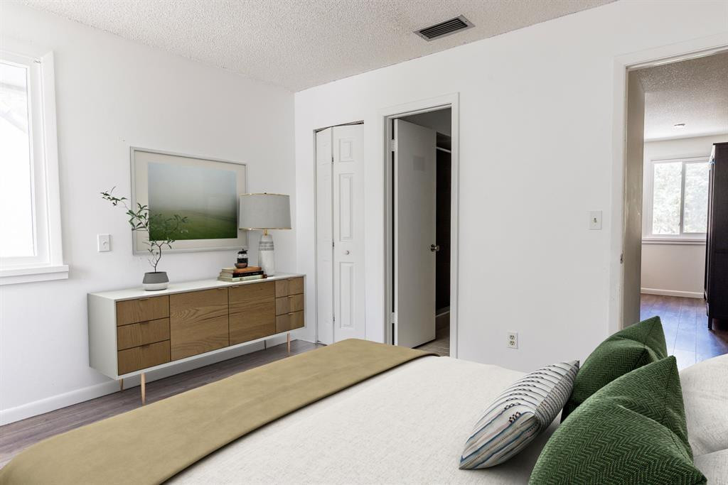 2945 Begonia Way Cooper City, FL 33026 - Photo 5 of 26 a bedroom with a bed and a flat screen tv