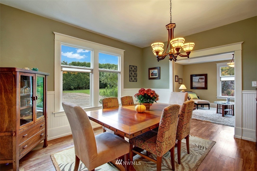 7405 Skipley Road Snohomish, WA 98290 - Photo 12 of 25 a view of a dining room with furniture wooden floor and chandelier
