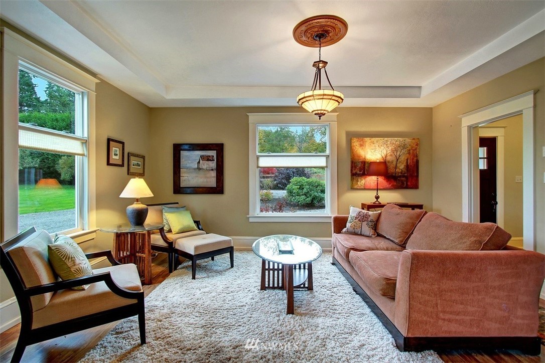 7405 Skipley Road Snohomish, WA 98290 - Photo 13 of 25 a living room with furniture a chandelier and a large window
