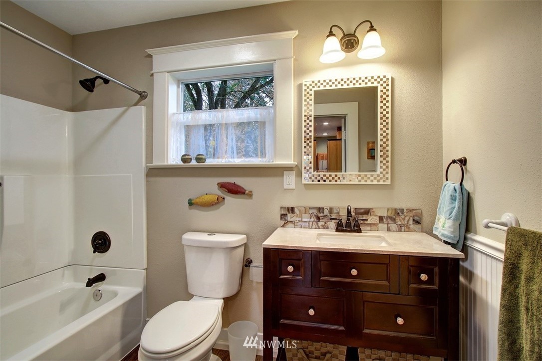 7405 Skipley Road Snohomish, WA 98290 - Photo 15 of 25 a bathroom with a sink vanity mirror and toilet