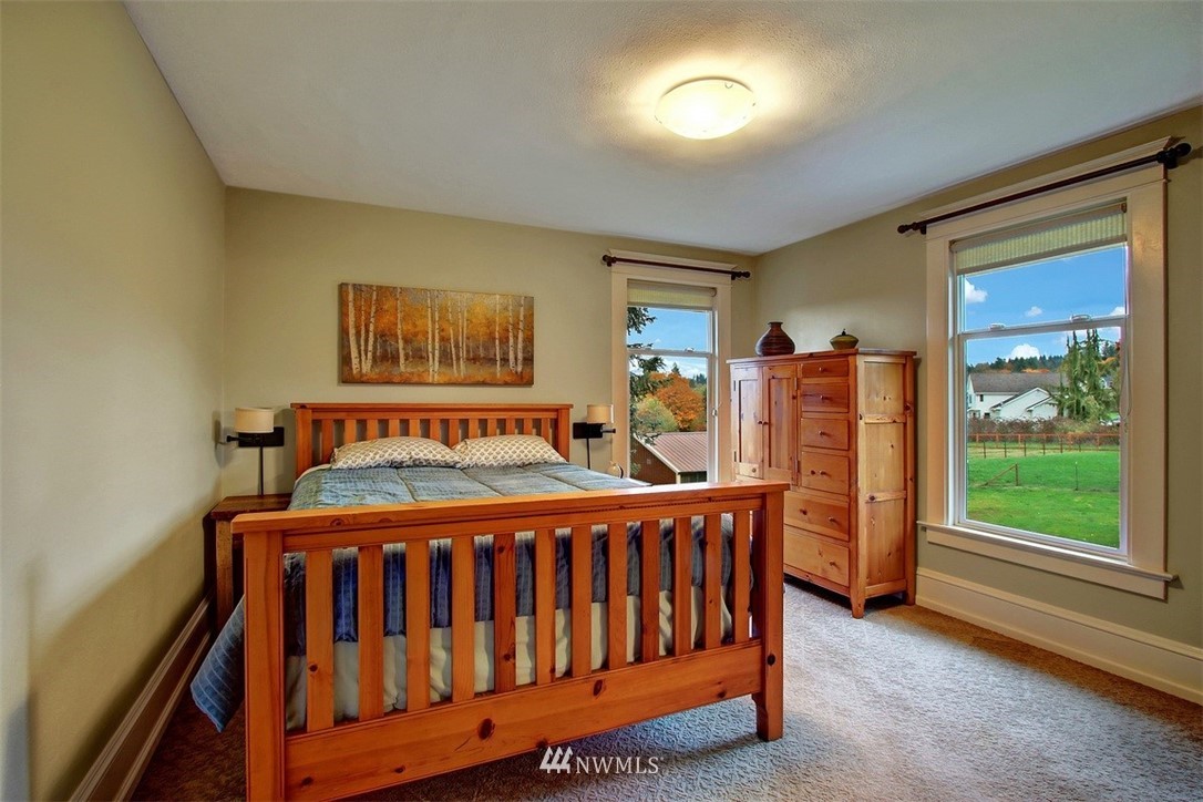 7405 Skipley Road Snohomish, WA 98290 - Photo 18 of 25 a bedroom with furniture and a window