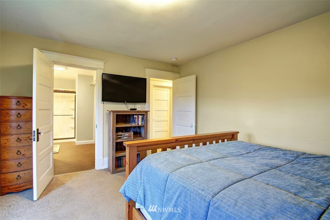 7405 Skipley Road Snohomish, WA 98290 - Photo 19 of 25 a bedroom with a bed and a flat screen tv