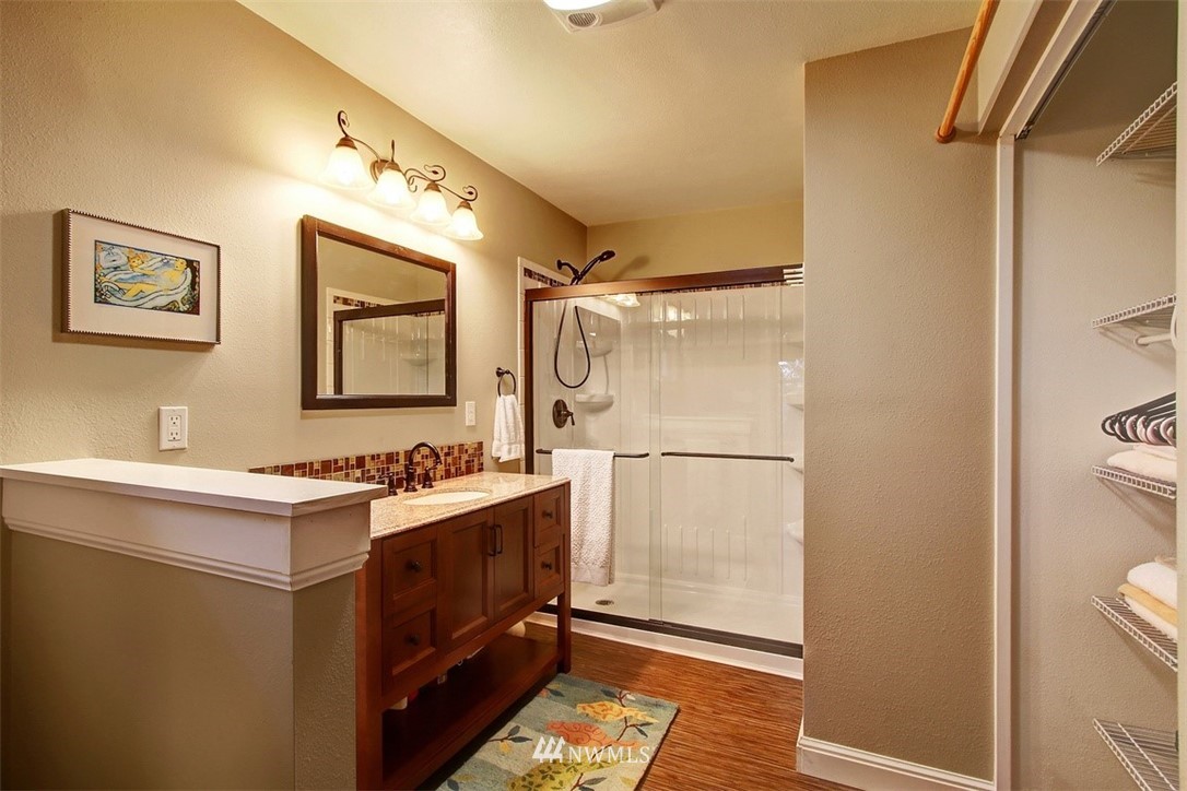 7405 Skipley Road Snohomish, WA 98290 - Photo 20 of 25 a bathroom with a sink mirror and a toilet