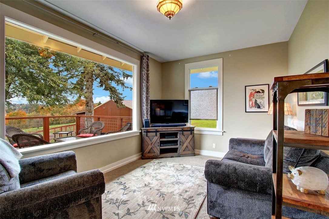 7405 Skipley Road Snohomish, WA 98290 - Photo 7 of 25 a living room with furniture and a flat screen tv