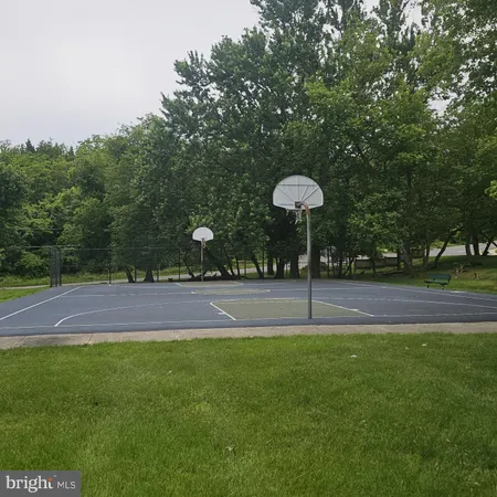 a swimming pool is in the middle of a field