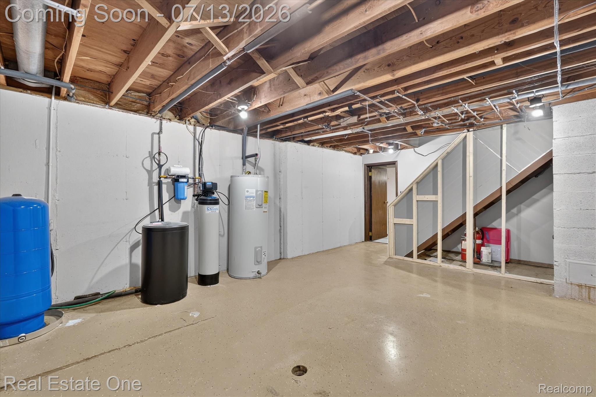 6039 Fish Lake Road Holly, MI 48442 - Photo 42 of 70 Spacious partially finished basement area with epoxy flooring.