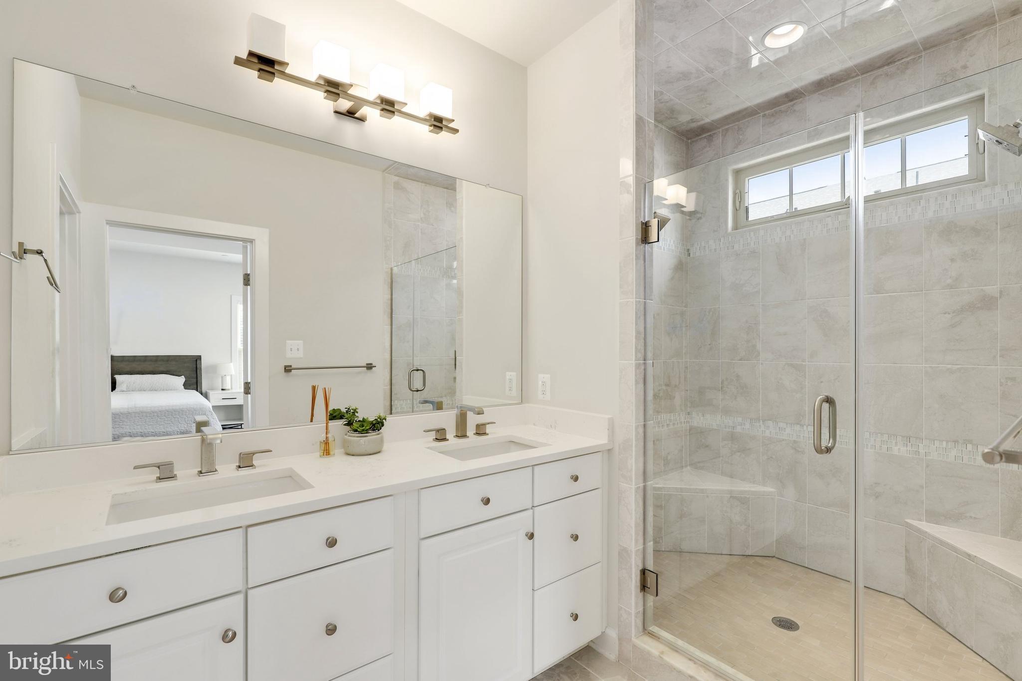 1028 Mutual Place Sandy Spring, MD 20860 - Photo 16 of 35 a bathroom with double sink shower and a mirror
