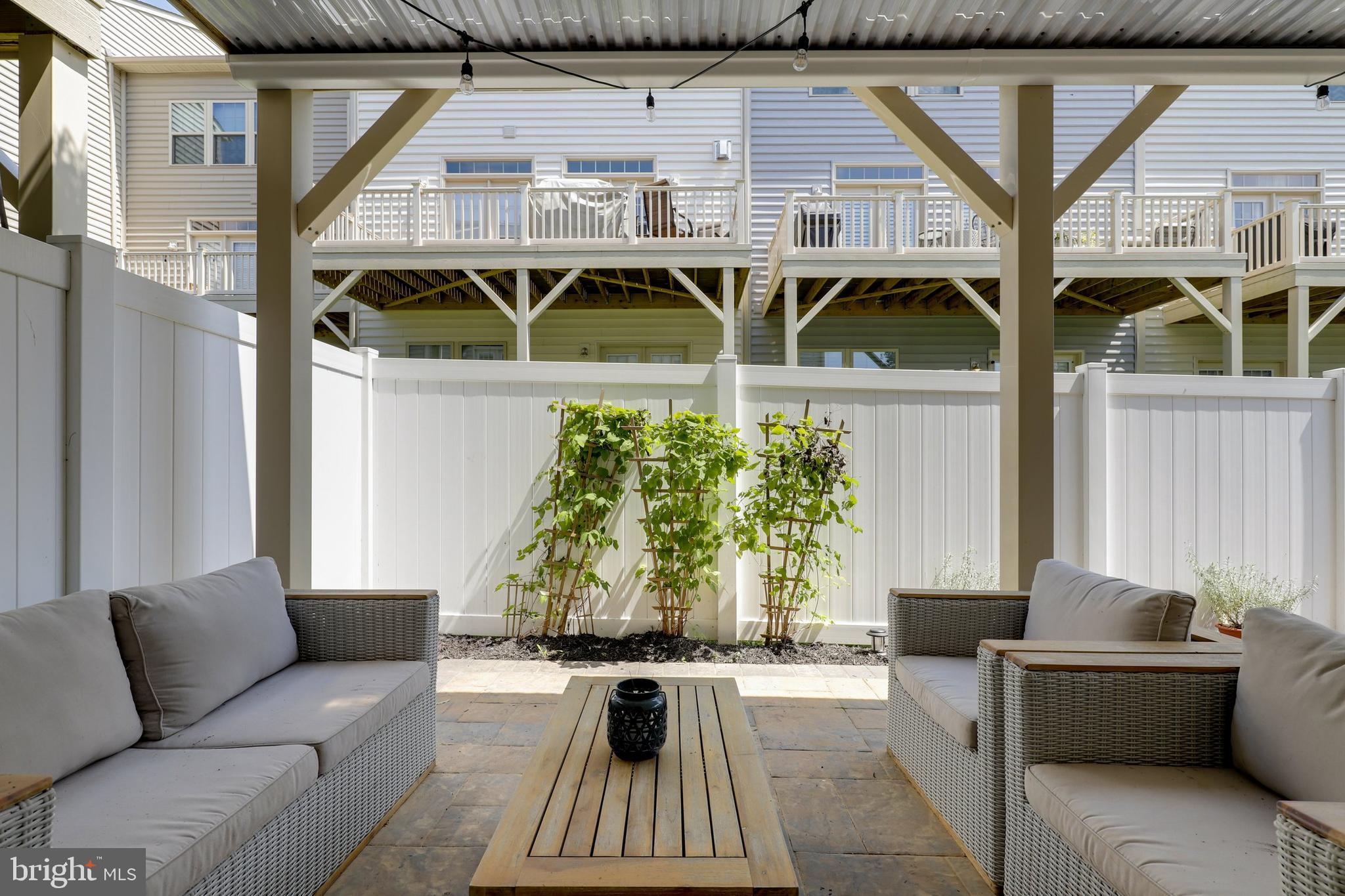 1028 Mutual Place Sandy Spring, MD 20860 - Photo 27 of 35 a balcony view with couches and a potted plant