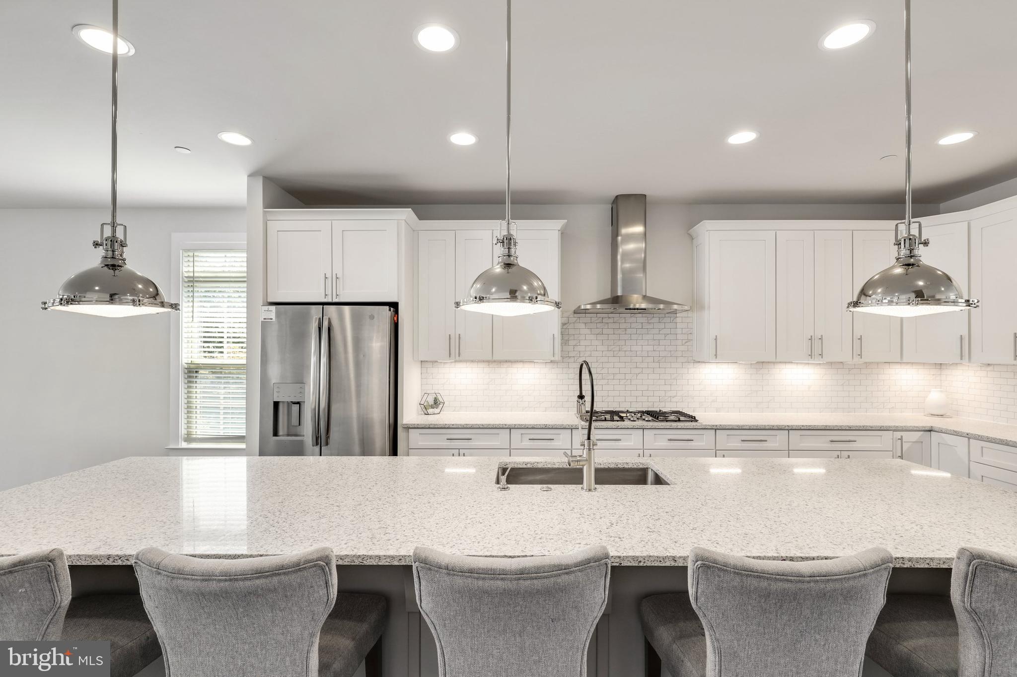 1028 Mutual Place Sandy Spring, MD 20860 - Photo 6 of 35 a kitchen with a table and chairs