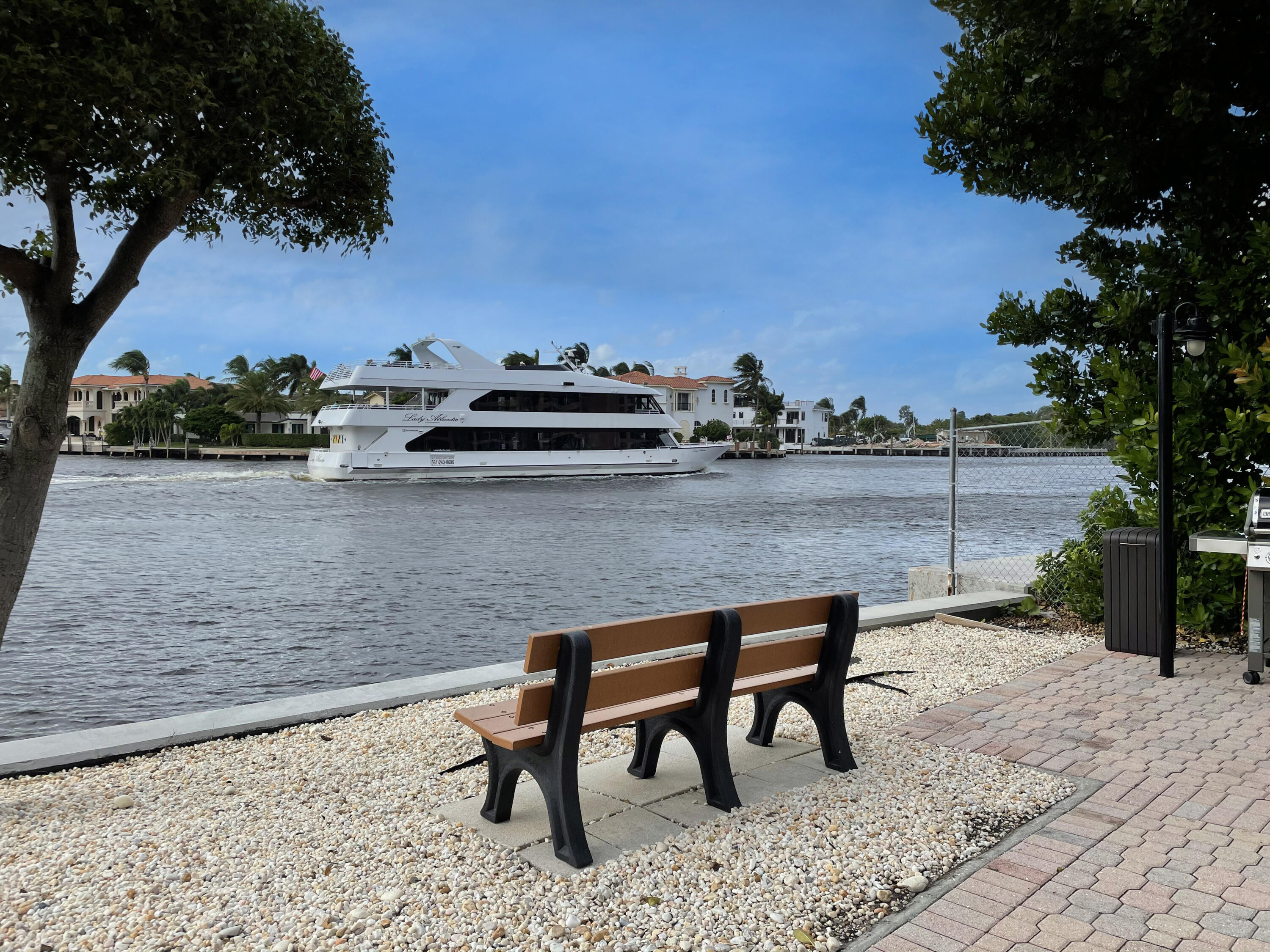 2707 North Ocean Boulevard, Unit D706 Boca Raton, FL 33431 - Photo 50 of 80 a view of a bench in a backyard