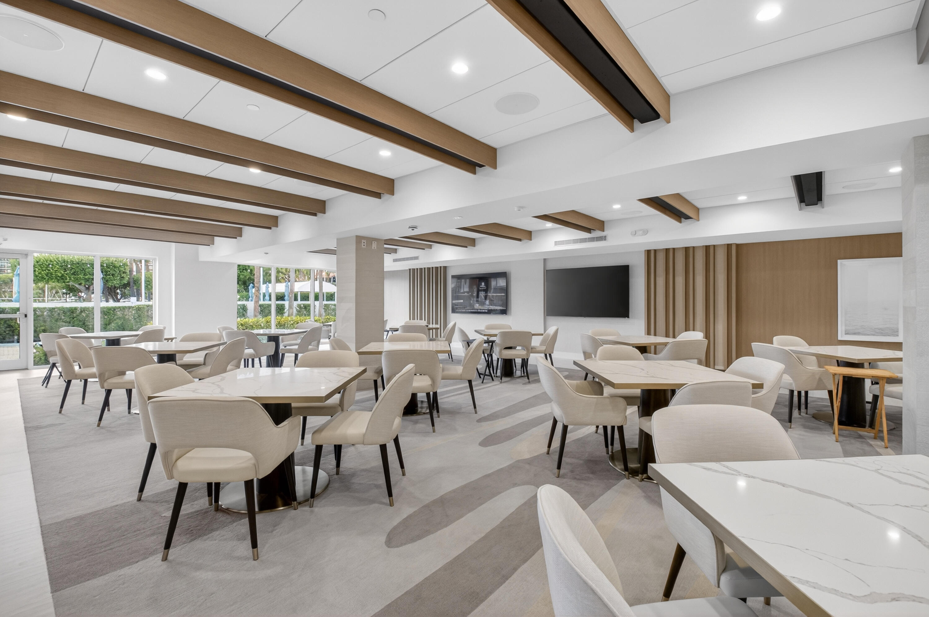 2707 North Ocean Boulevard, Unit D706 Boca Raton, FL 33431 - Photo 52 of 80 a living room with lots of furniture and a large window