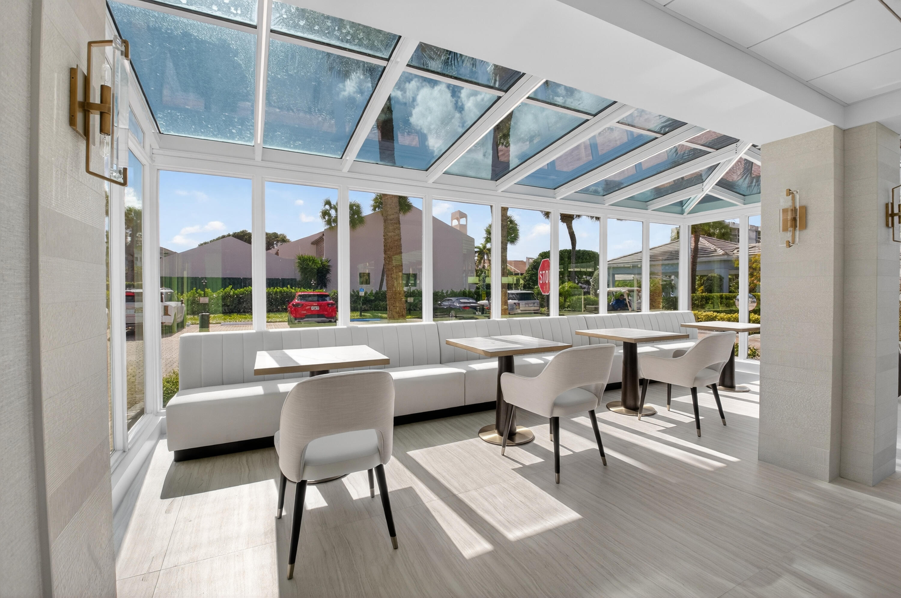 2707 North Ocean Boulevard, Unit D706 Boca Raton, FL 33431 - Photo 65 of 80 a dining room with wooden floor and white walls