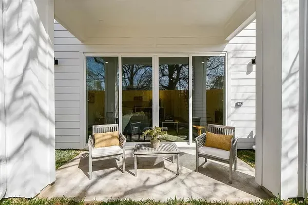 a outdoor space with patio the couches and a dining table with the view of the balcony