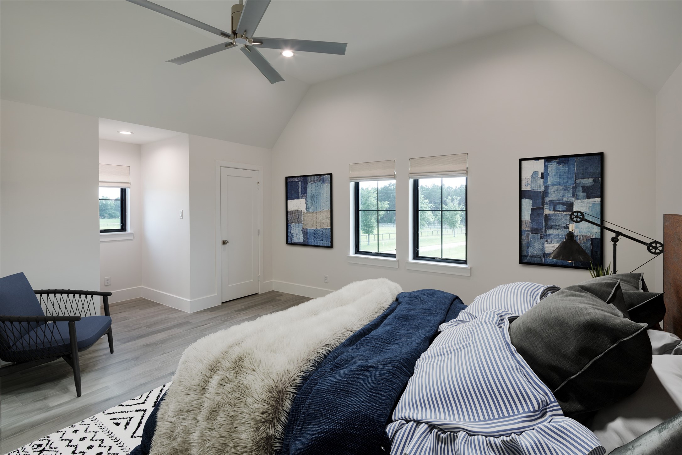 24118 Margerstadt Road Hockley, TX 77447 - Photo 29 of 46 Elevated ceilings, oversized windows, and comfortable proportions give the secondary bedrooms flexibility for both family and guest use over time. Clean finishes and soft natural light keep the spaces feeling cohesive with the rest of the home.