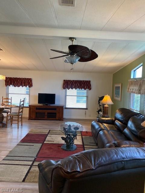 139 Rookery Road Naples, FL 34114 - Photo 11 of 37 a living room with furniture and a chandelier