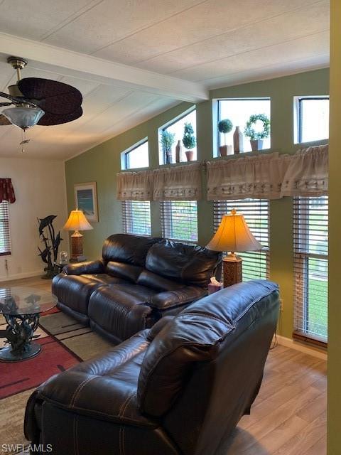 139 Rookery Road Naples, FL 34114 - Photo 12 of 37 a living room with furniture and a lamp