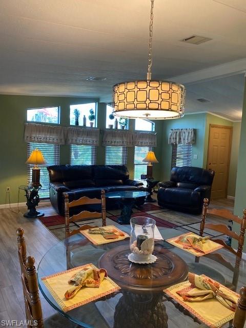 139 Rookery Road Naples, FL 34114 - Photo 14 of 37 a living room with furniture a window and a chandelier