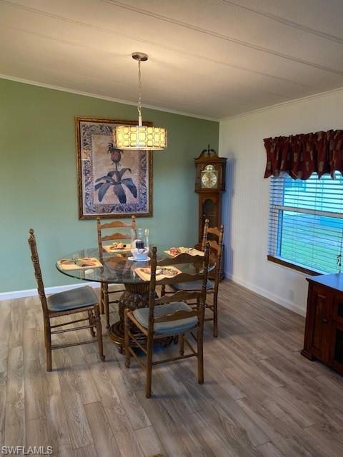 139 Rookery Road Naples, FL 34114 - Photo 16 of 37 a view of a dining room with furniture window and wooden floor