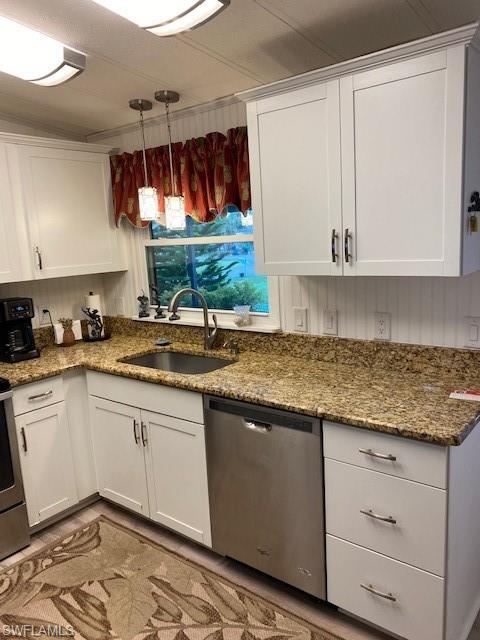 139 Rookery Road Naples, FL 34114 - Photo 20 of 37 a kitchen with granite countertop a sink and a stove
