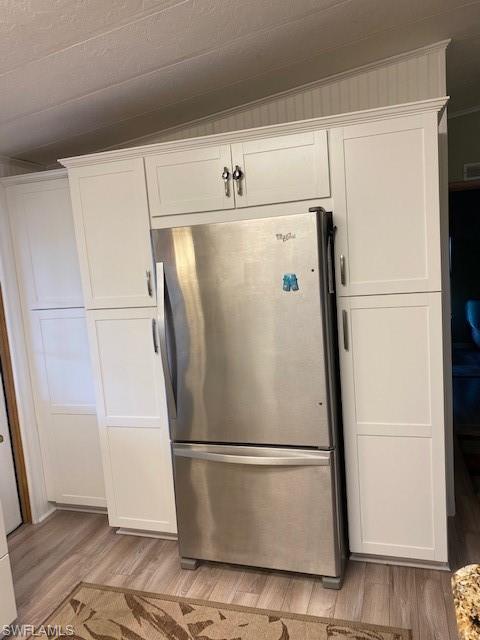 139 Rookery Road Naples, FL 34114 - Photo 23 of 37 a white refrigerator freezer sitting in a kitchen