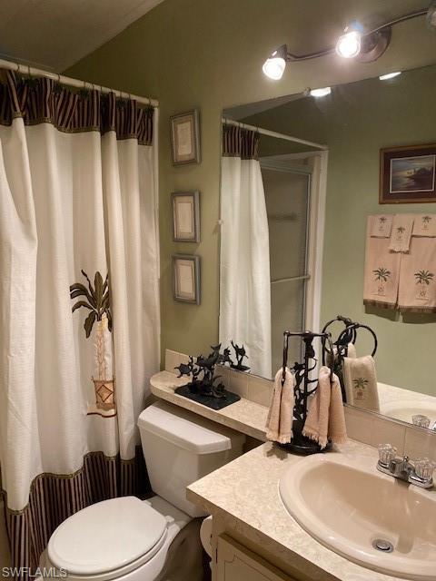 139 Rookery Road Naples, FL 34114 - Photo 25 of 37 a bathroom with a sink toilet and shower
