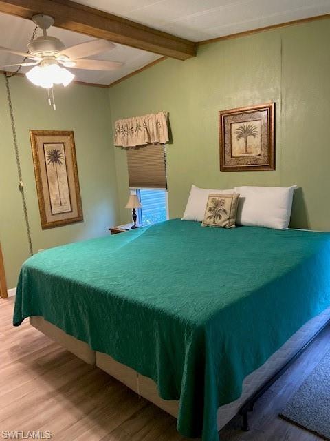 139 Rookery Road Naples, FL 34114 - Photo 29 of 37 a bedroom with a bed and a chandelier