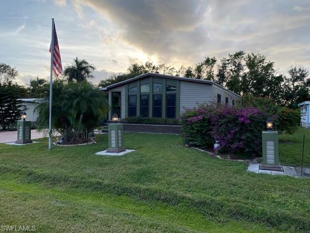 139 Rookery Road Naples, FL 34114 - Photo 3 of 37 a view of a house with a yard and plants