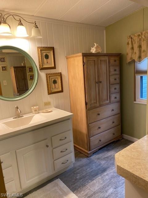 139 Rookery Road Naples, FL 34114 - Photo 31 of 37 a bathroom with a sink a vanity and a mirror