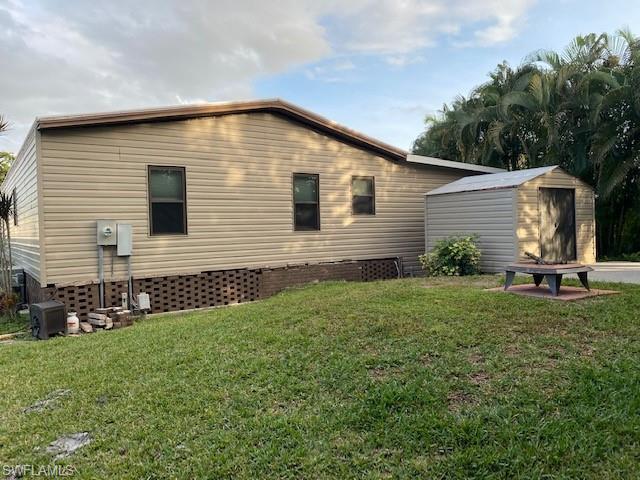 139 Rookery Road Naples, FL 34114 - Photo 34 of 37 a view of a backyard with plants and a garden