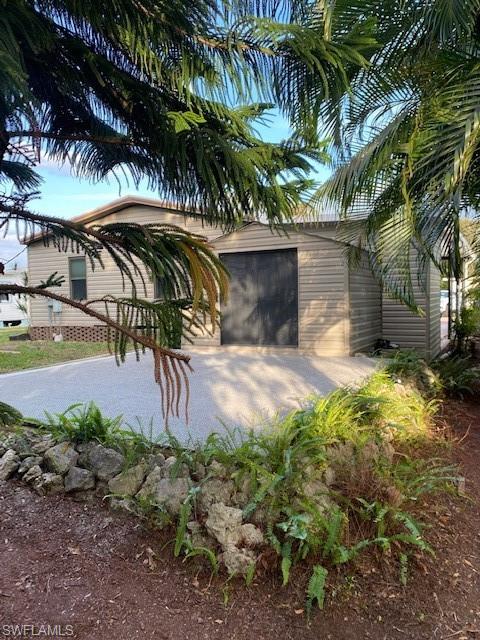 139 Rookery Road Naples, FL 34114 - Photo 35 of 37 a view of outdoor space and yard