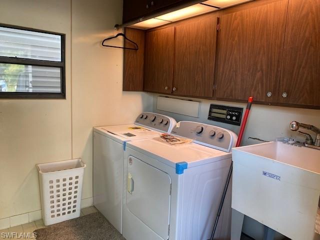 139 Rookery Road Naples, FL 34114 - Photo 36 of 37 a utility room with dryer and washer
