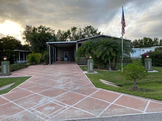 139 Rookery Road Naples, FL 34114 - Photo 5 of 37 a backyard of a house with a garden and plants