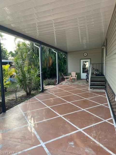 139 Rookery Road Naples, FL 34114 - Photo 6 of 37 a room with lots of trees and couches