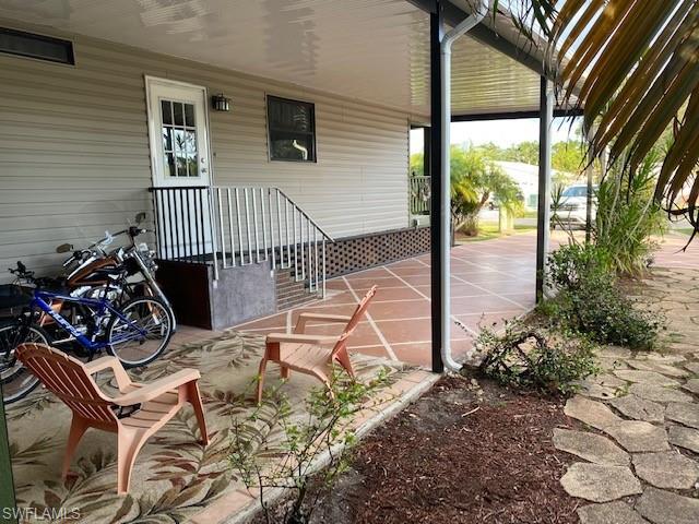 139 Rookery Road Naples, FL 34114 - Photo 9 of 37 a view of a balcony with chairs