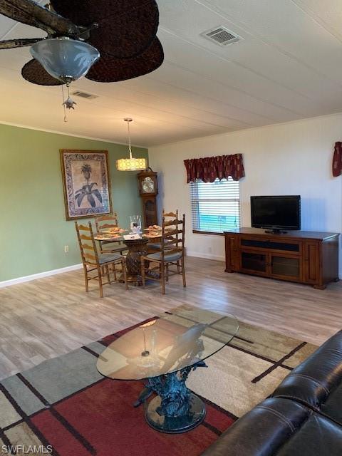 139 Rookery Road Naples, FL 34114 - Photo 10 of 37 a living room with furniture and a flat screen tv