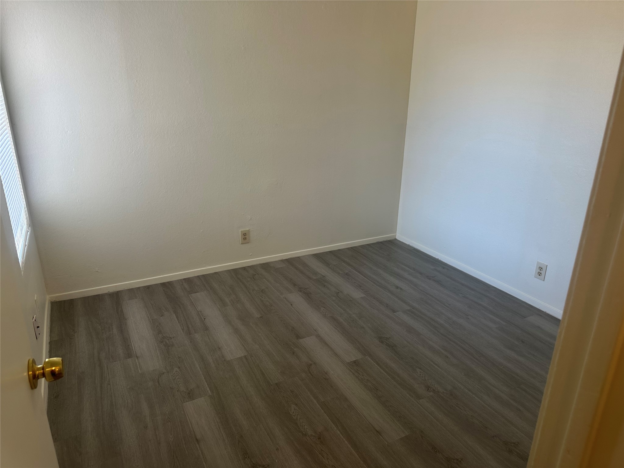 2602 South Bagdad Road, Unit B Leander, TX 78641 - Photo 14 of 23 Smooth plaster walls and rich plank flooring define this versatile, sunlit interior space.