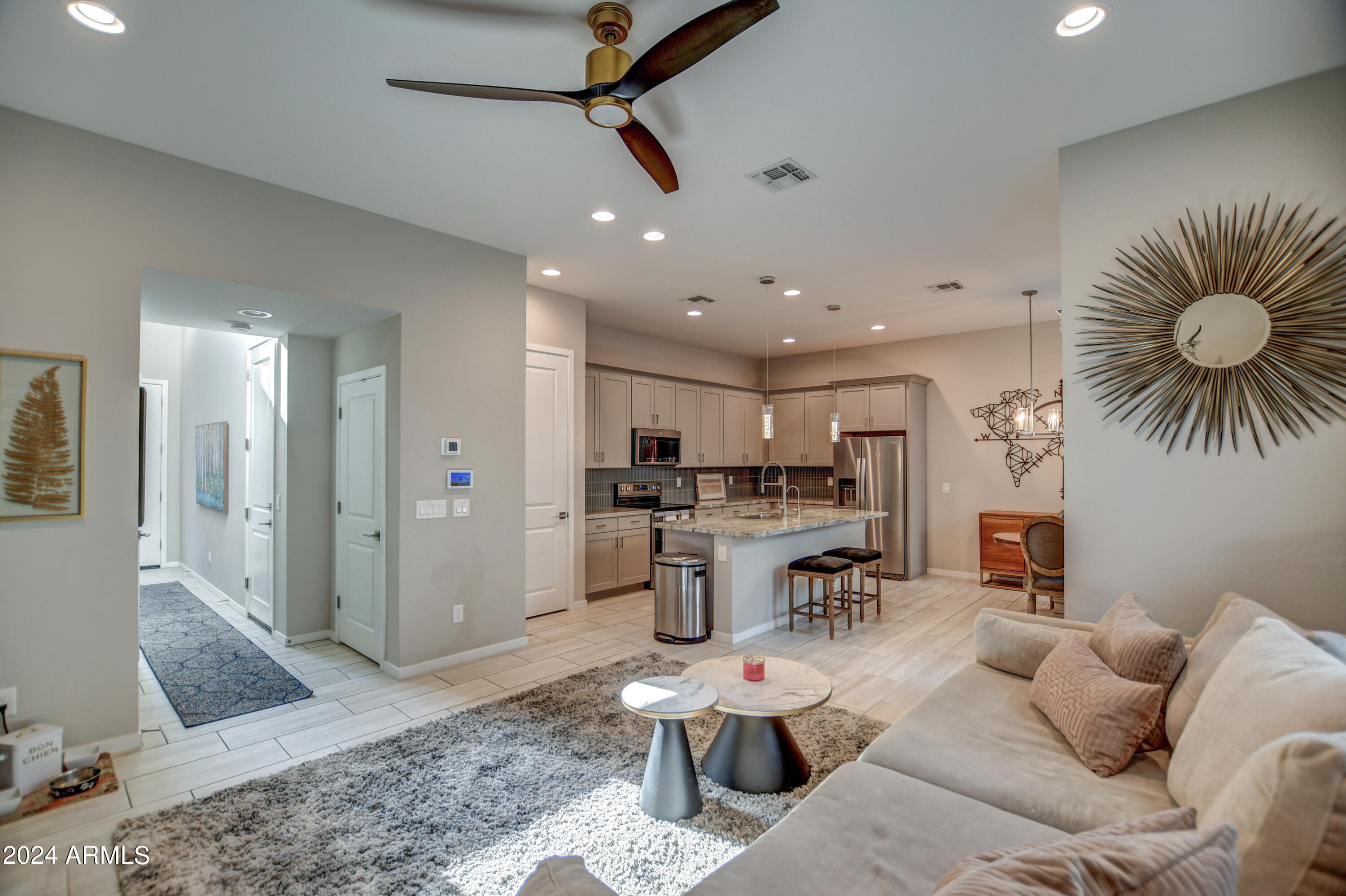 901 South Smith Road, Unit 1033 Tempe, AZ 85281 - Photo 14 of 43 a living room with furniture and kitchen view