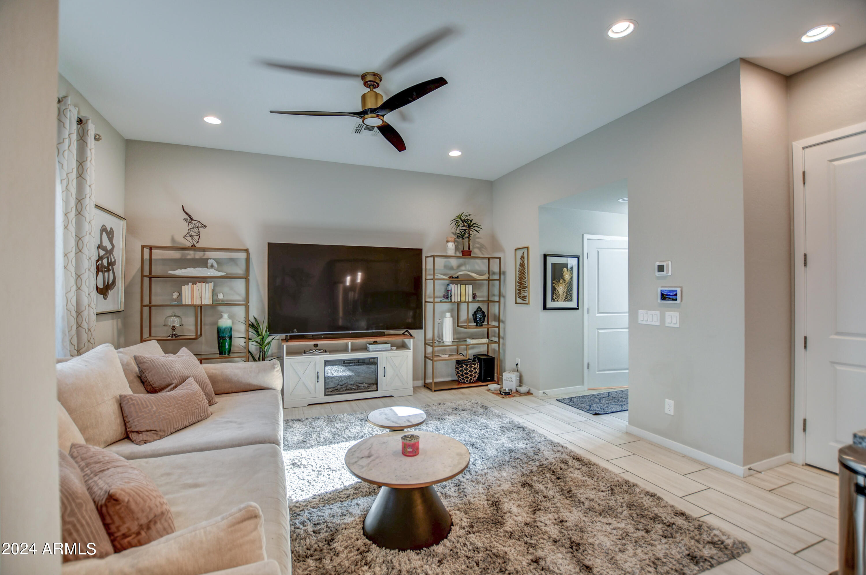 901 South Smith Road, Unit 1033 Tempe, AZ 85281 - Photo 16 of 43 a living room with furniture and a flat screen tv